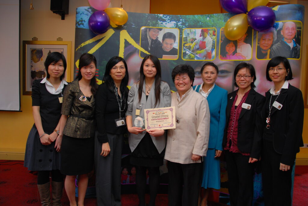 Sylvia (fourth from right) and Crystal at the Goldstar Volunteer Awards in 2009.